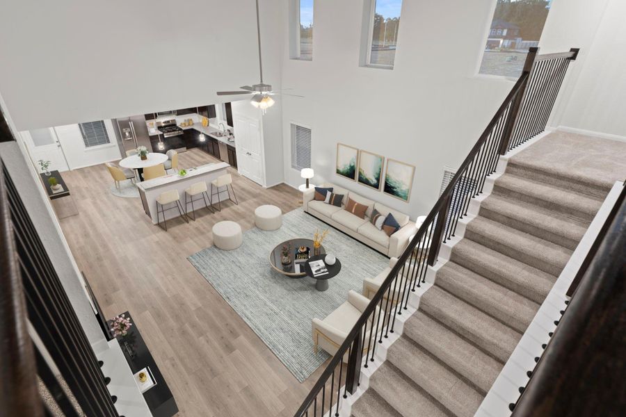 From the second-floor landing, you’ll enjoy a beautiful view overlooking the open-concept family room below. The soaring ceilings and open rail design enhance the home’s spacious, airy feel.