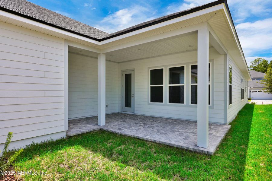 Front exterior of a new home in Seabrook Village at Seabrook, Ponte Vedra, FL, highlighting curb appeal (Image 20).