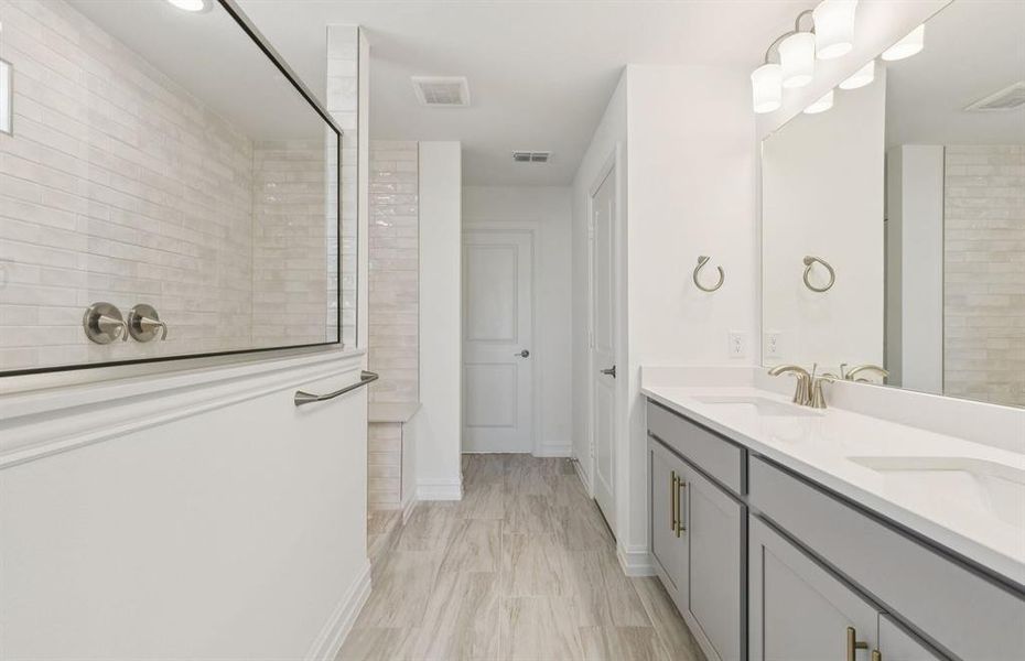 Owner's private bath with double vanity