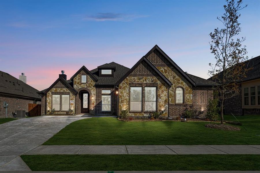 Front exterior of a new home in Meadow Vista 60-65, Anna, TX, highlighting curb appeal (Image 2). Front exterior of a new home in Meadow Vista 60-65, Anna, TX, highlighting curb appeal (Image 2).