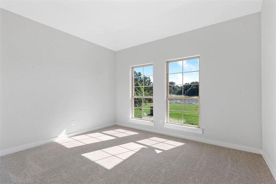 Carpeted empty room with plenty of natural light