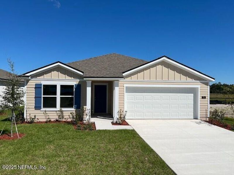 Front exterior of a new home in Sawmill Branch Express, Palm Coast, FL, highlighting curb appeal (Image 2).