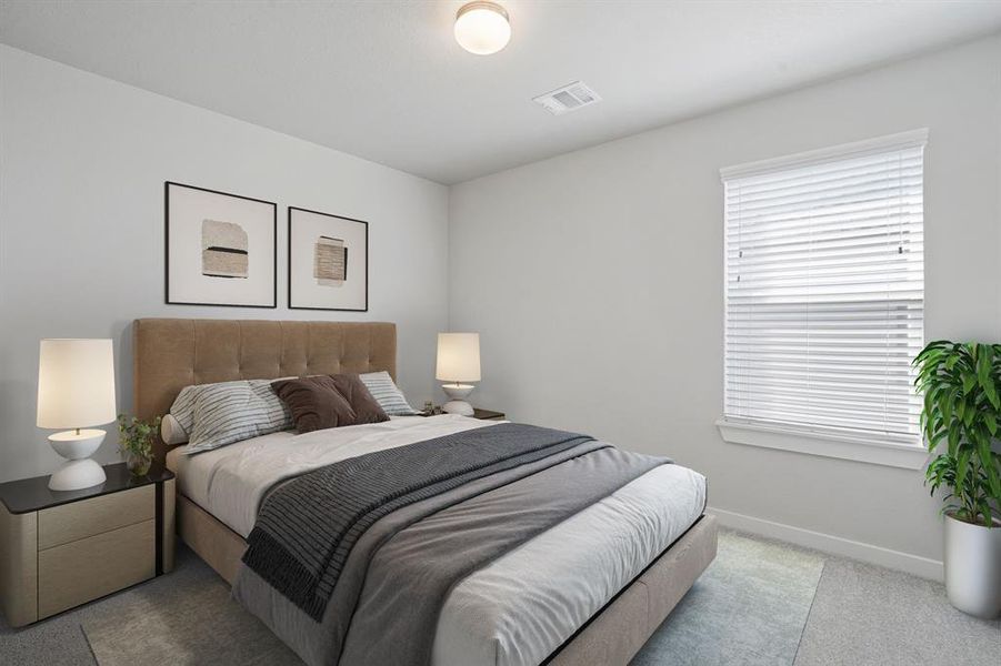 Step into one of your 3 secondary bedrooms. Featuring plush carpet, custom paint, and a large window with let in the perfect amount for natural lighting.