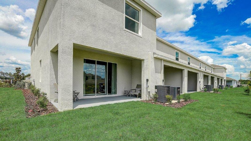 Exterior details and patio area of a home in Angeline Townhomes, Land O' Lakes (Image 3). Exterior details and patio area of a home in Angeline Townhomes, Land O' Lakes (Image 3).
