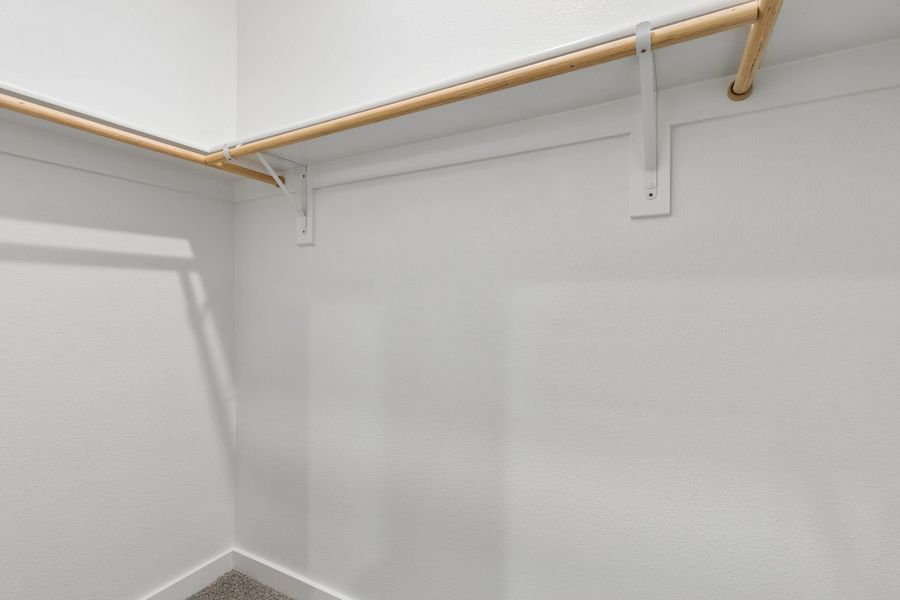 Primary Closet in the Cypress home plan by Trophy Signature Homes - REPRESENTATIVE PHOTO