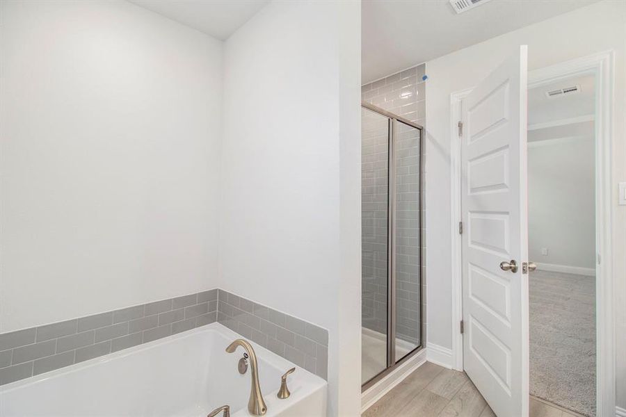 Primary Bathroom with Separate Shower and Bathtub