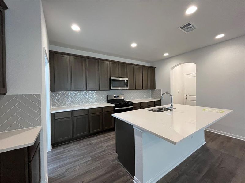 Furnished interior view inside a new home in Wellspring, Round Rock (Image 5).