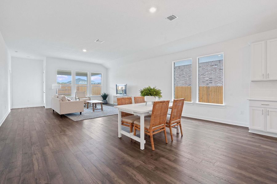 Dining area with plenty of natural light, dark wood-type flooring, and recessed lighting Dining area with plenty of natural light, dark wood-type flooring, and recessed lighting