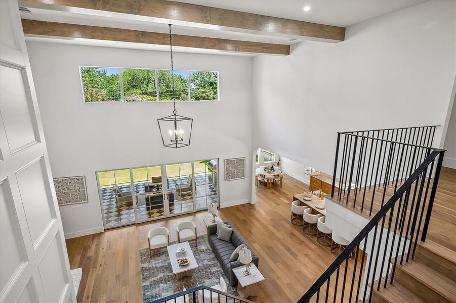 Living room overhead, stone fireplace, exposed beams, patio access Living room overhead, stone fireplace, exposed beams, patio access