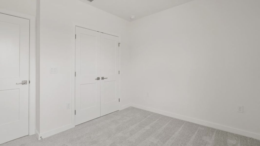 Furnished interior view inside a new home in Grasslands West, Lakeland (Image 25).