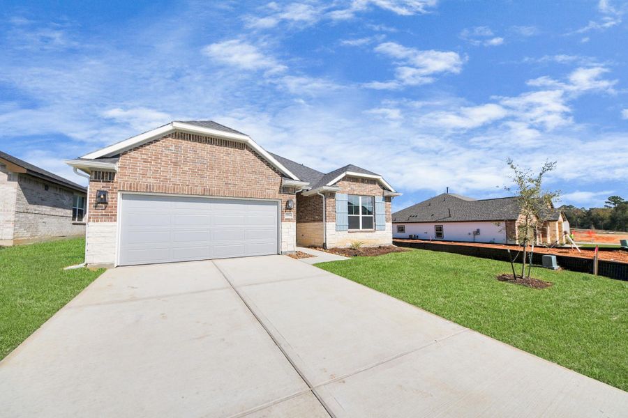 Front exterior of a new home in Lexington Heights, Willis, TX, highlighting curb appeal (Image 23).