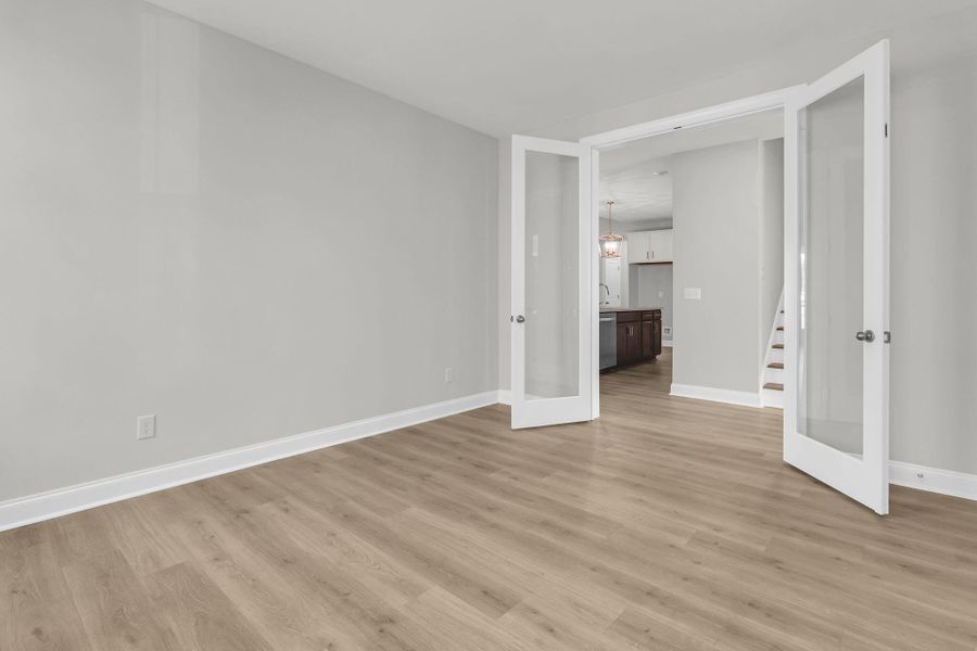 Spacious, unfurnished interior of a new home in Tidewater at Lakes of Cane Bay, Summerville (Image 17).
