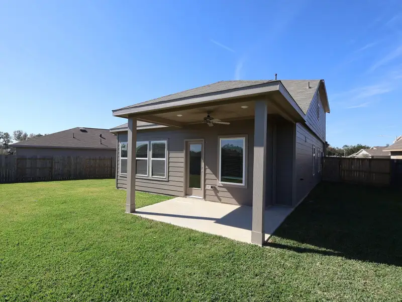 Exterior details and patio area of a home in Pinewood at Grand Texas, New Caney (Image 3).