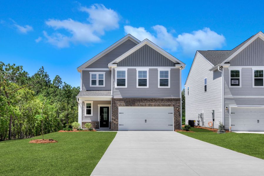 Front exterior of a new home in The Mill at Woodcreek Farms, Elgin, SC, highlighting curb appeal (Image 29). Front exterior of a new home in The Mill at Woodcreek Farms, Elgin, SC, highlighting curb appeal (Image 29).