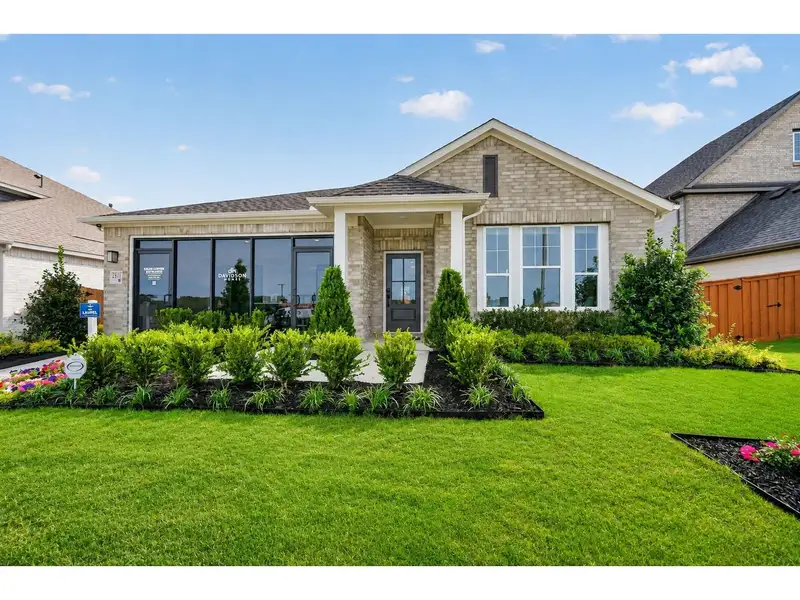 Front exterior of a new home in Heartland, Crandall, TX, highlighting curb appeal (Image 1). Front exterior of a new home in Heartland, Crandall, TX, highlighting curb appeal (Image 1).