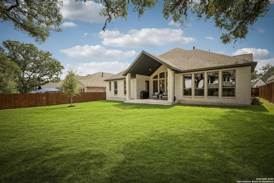 Exterior details and patio area of a home in Balcones Creek 70', Boerne (Image 4).