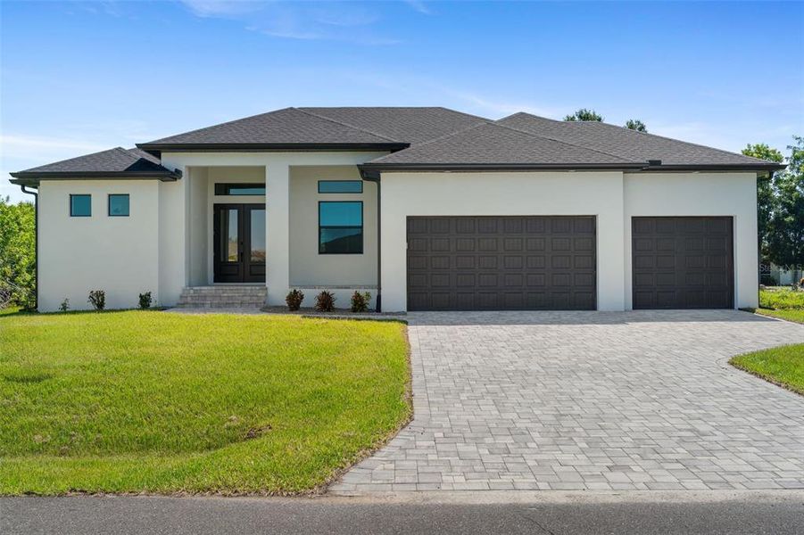 Front exterior of a new home in , Port Charlotte, FL, highlighting curb appeal (Image 1). Front exterior of a new home in , Port Charlotte, FL, highlighting curb appeal (Image 1).