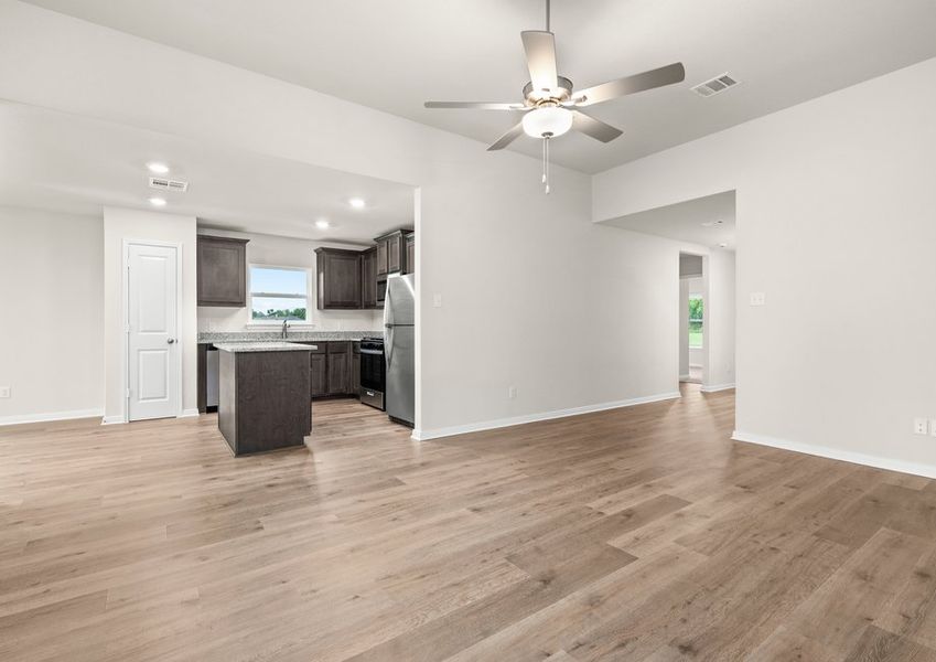 The family room connects to the kitchen and dining room. The family room connects to the kitchen and dining room.