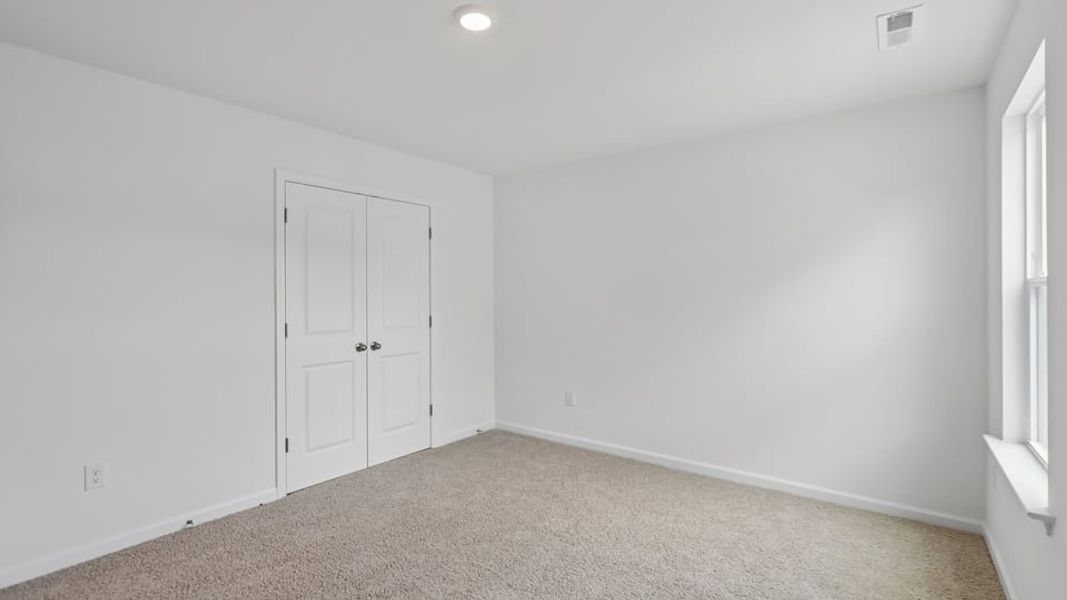 Representative unfurnished interior of a home built from the Manning by D.R. Horton in Laurel Oaks, Sanford (Image 28). Representative unfurnished interior of a home built from the Manning by D.R. Horton in Laurel Oaks, Sanford (Image 28).