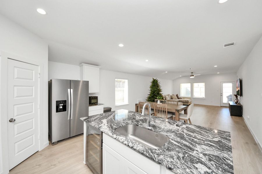 The kitchen features the perfect place for a coffee bar and offers a large walk-in pantry.