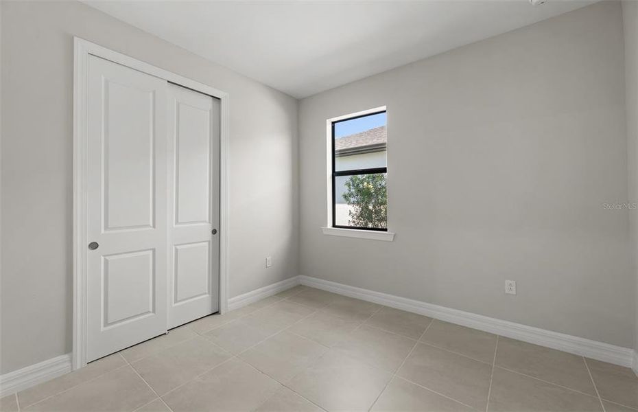 Spacious, unfurnished interior of a new home in Cedar Grove at The Woodlands, North Port (Image 11).
