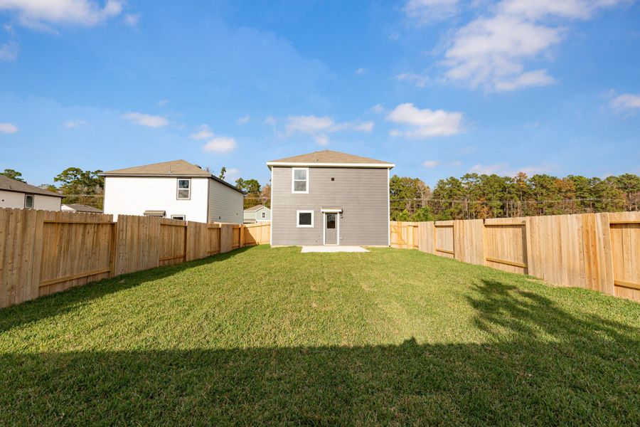 Exterior details and patio area of a home in Townsend Reserve, Splendora (Image 3).