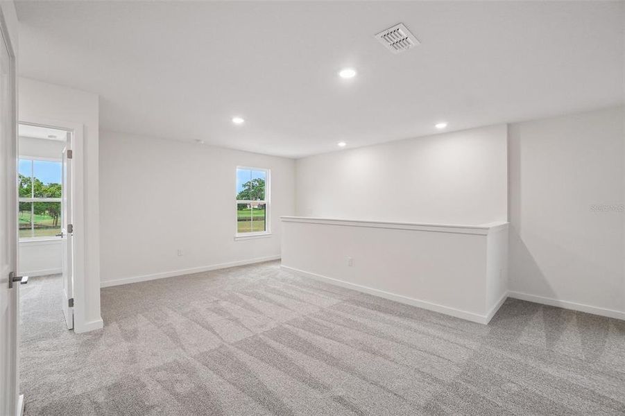 Spacious, unfurnished interior of a new home in Grasslands West, Lakeland (Image 45).