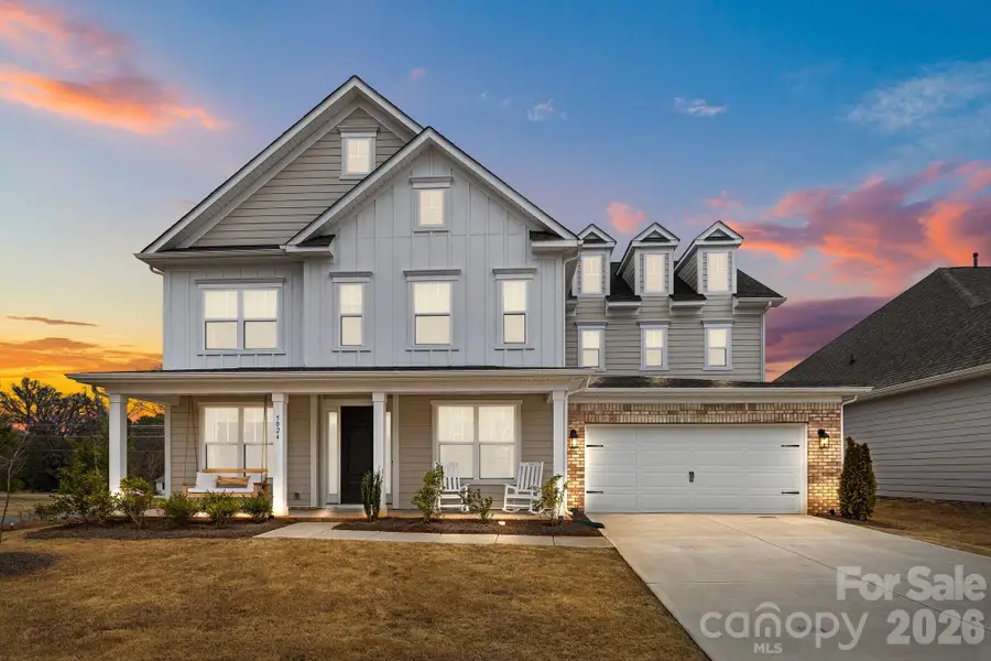 Front exterior of a new home in , Mint Hill, NC, highlighting curb appeal (Image 25).