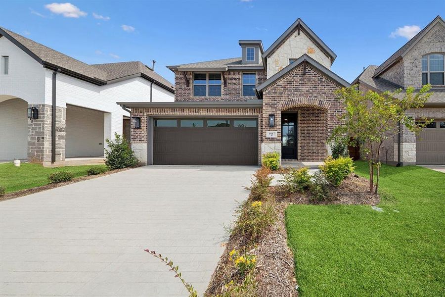 Front exterior of a new home in Solterra - Garden Series, Mesquite, TX, highlighting curb appeal (Image 2). Front exterior of a new home in Solterra - Garden Series, Mesquite, TX, highlighting curb appeal (Image 2).