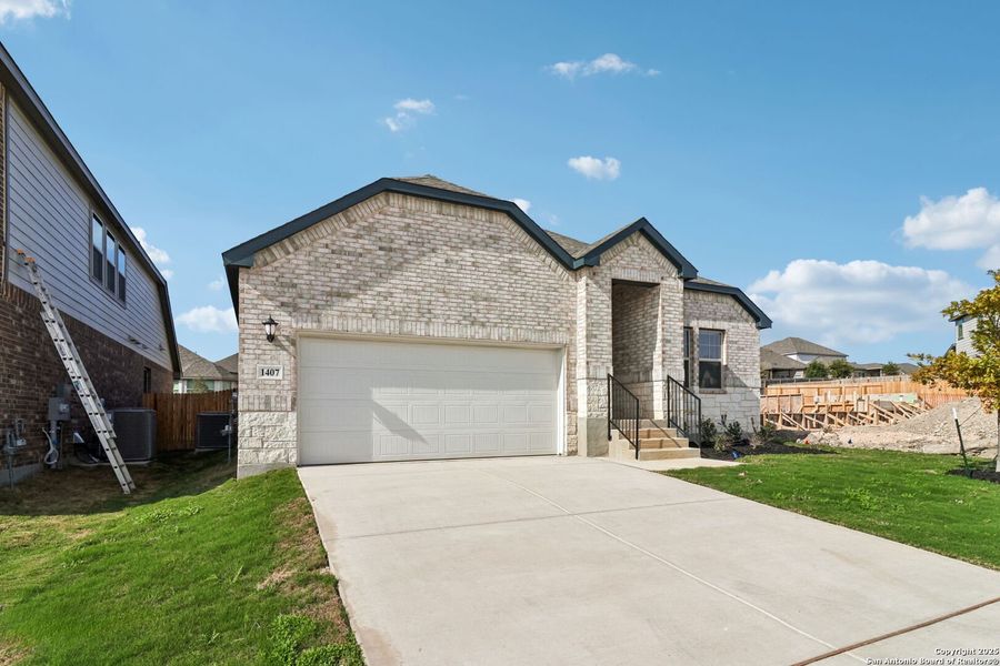 Front exterior of a new home in Arcadia Ridge - Classic Series, San Antonio, TX, highlighting curb appeal (Image 22).