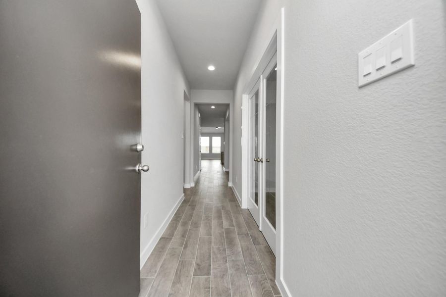 As you step into the threshold of this luxurious home, you'll soon be welcomed by anelegant glass door (to be installed). Inside, soaring ceilings amplify the spaciousness,while the refined wood-look tile flooring and oversized baseboards exudesophistication and charm.