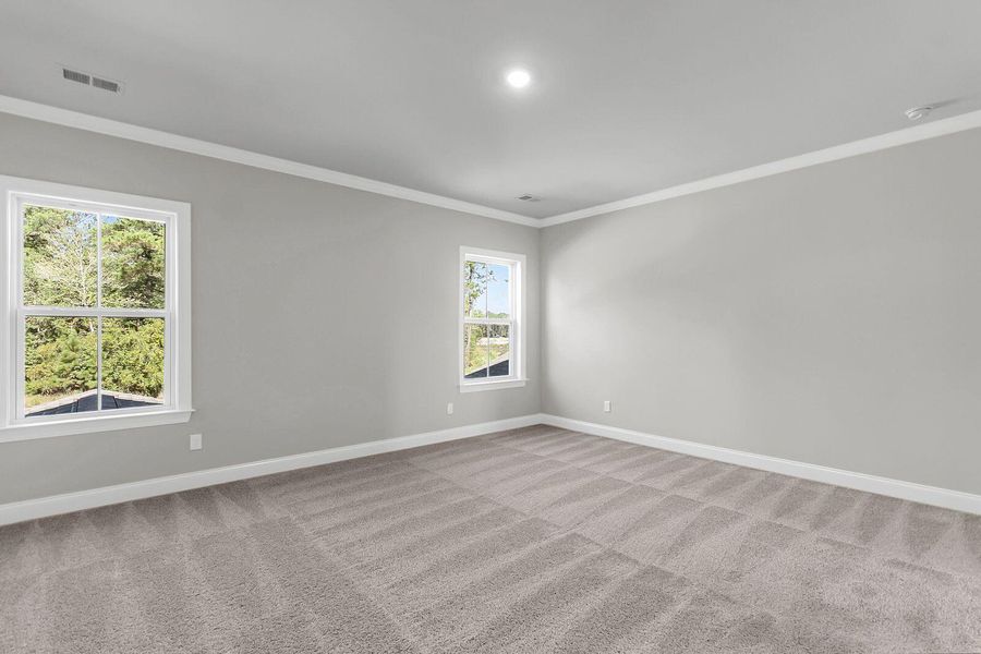 Spacious, unfurnished interior of a new home in Tidewater at Lakes of Cane Bay, Summerville (Image 17).