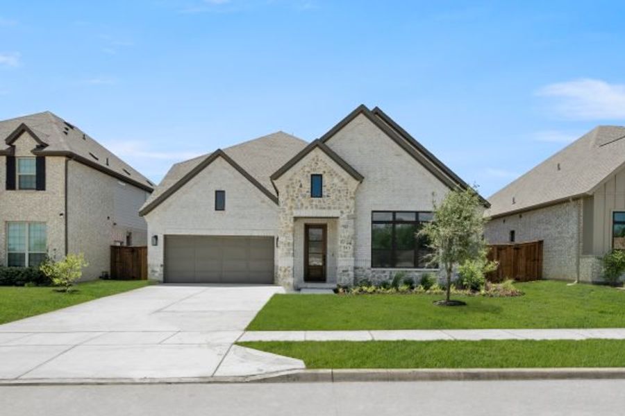 Front exterior of a new home in Rio Vista at Kelly Ranch, Aledo, TX, highlighting curb appeal (Image 27). Front exterior of a new home in Rio Vista at Kelly Ranch, Aledo, TX, highlighting curb appeal (Image 27).