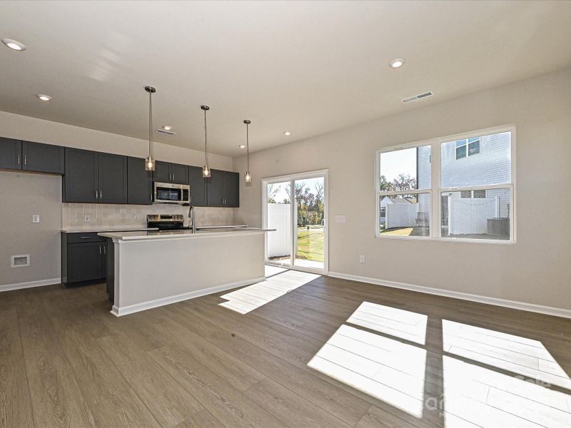 Natural Light Seeps Through the Space Through Large Windows. Natural Light Seeps Through the Space Through Large Windows.