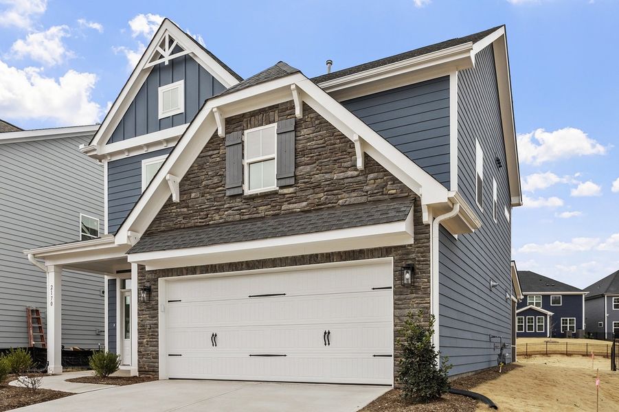 Front exterior of a new home in Sweetbrier, Durham, NC, highlighting curb appeal (Image 21).