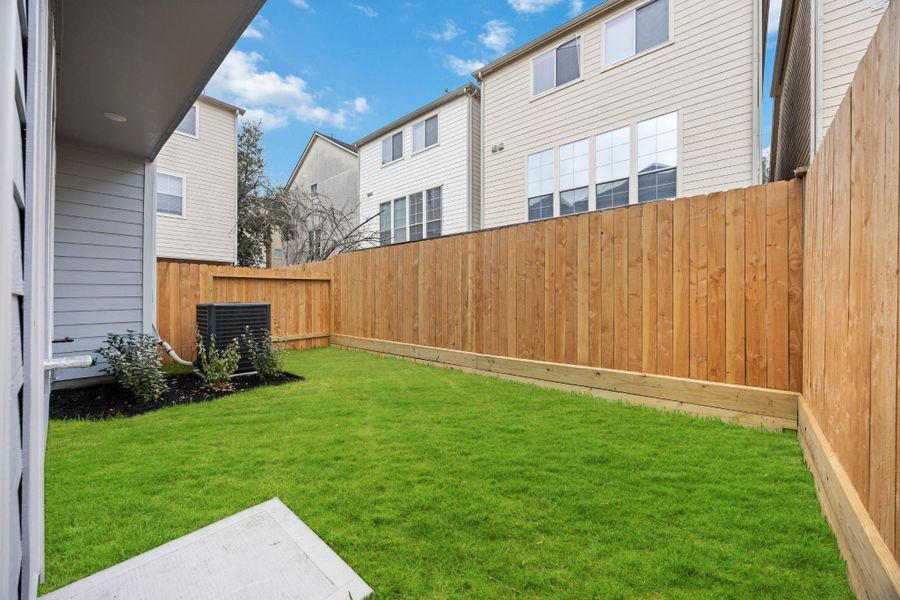 Private Backyard Perfection A right-sized green space—perfect for pets, grilling, or just soaking up some sun. This low-maintenance yard gives you space without the hassle.