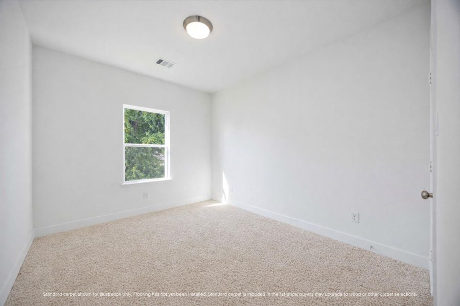 Secondary bedroom with great natural light and a walk-in closet — guests will want to stay awhile.