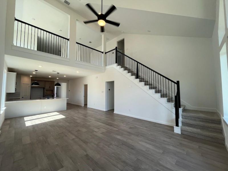 This layout creates a spacious, connected area perfect for entertaining and family gatherings.