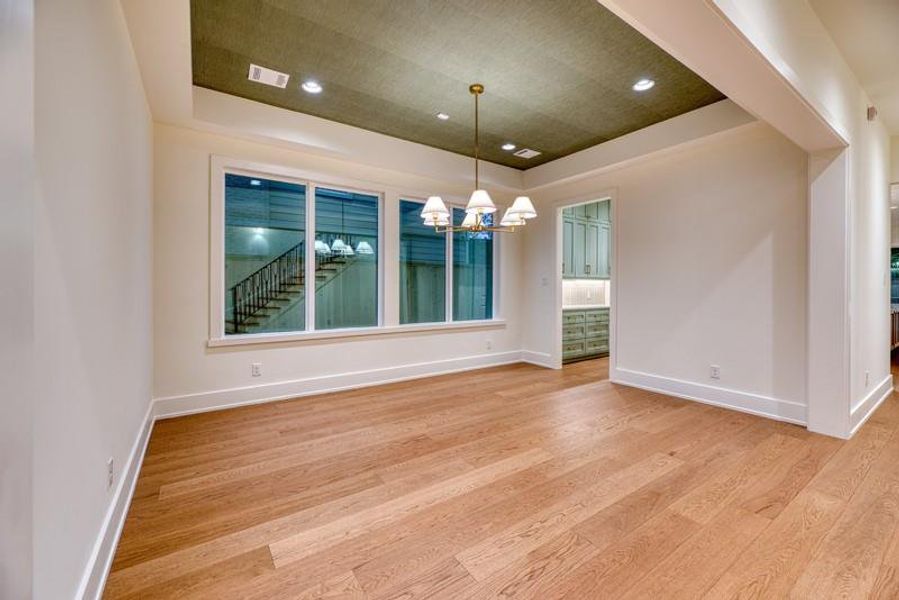Dining Room with accent ceiling