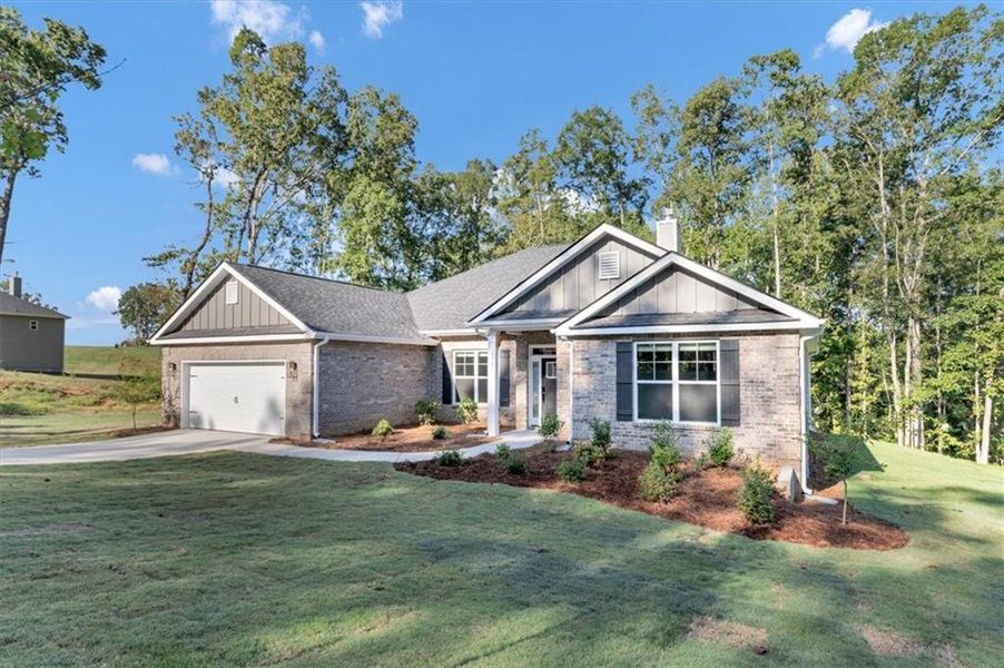 Front exterior of a new home in Tuscany Hills, Douglasville, GA, highlighting curb appeal (Image 20).