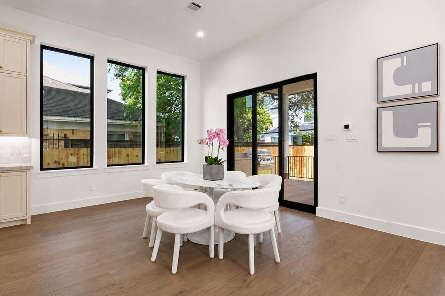 Oversized breakfast room with views to the oversized yard and outdoor kitchen. Paneled Sliding glass doors allow for indoor outdoor living