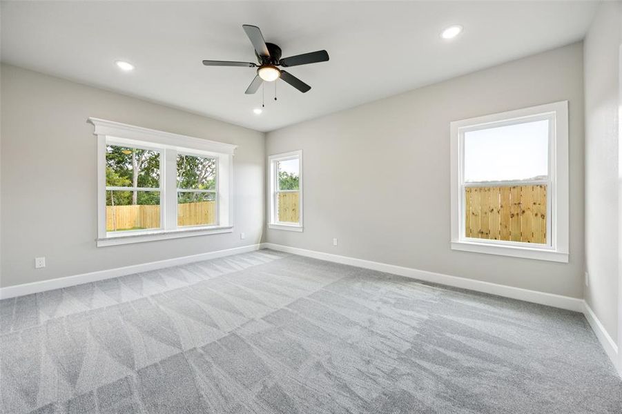 Spare room with carpet flooring, recessed lighting, and a ceiling fan Spare room with carpet flooring, recessed lighting, and a ceiling fan
