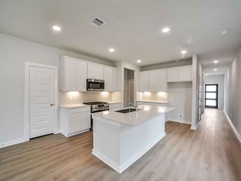 Furnished interior view inside a new home in Caney Creek Place, Conroe (Image 6).