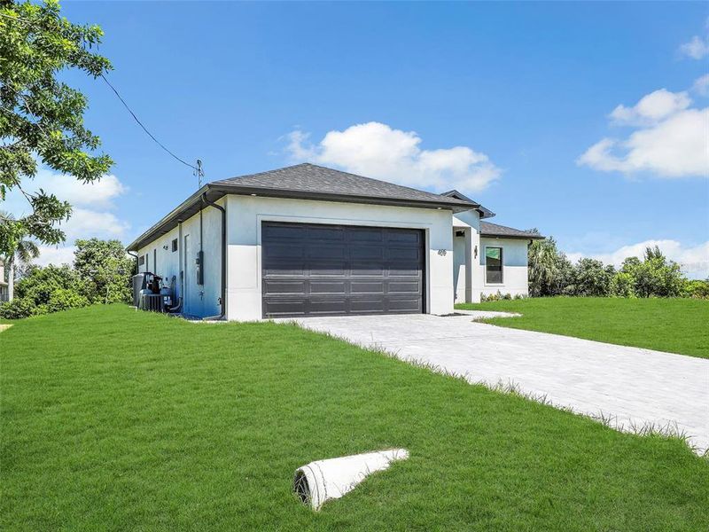 Front exterior of a new home in , Cape Coral, FL, highlighting curb appeal (Image 22).