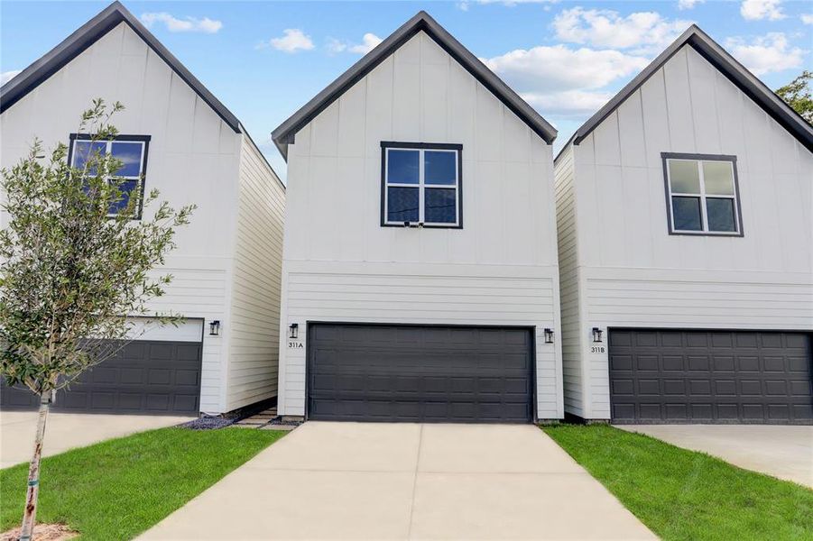 Each home has 2 car garage, long double wide driveway and sprinklers front and back. Oversized 21' X 18.5' garage fits 2 F-150s! Photos are of model but this home's floorplan is flipped - opposite orientation.