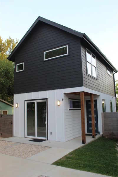 Bold two-tone siding complements this modern home's sharp architectural lines.