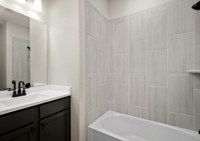 The secondary bathroom has a tub/shower combo.