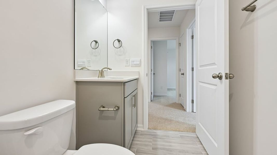 Furnished interior view inside a new home in The Estates Park, Apex (Image 12).