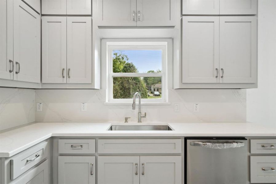 Kitchen with dishwasher and sink