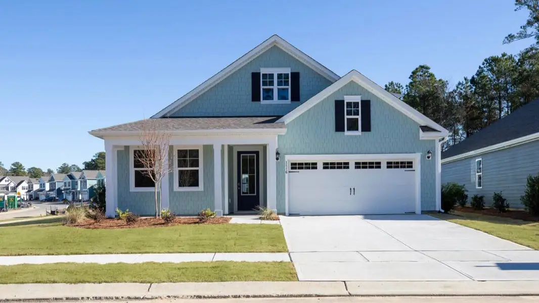 Front exterior of a new home in The Haven at Indigo Preserve, Leland, NC, highlighting curb appeal (Image 1). Front exterior of a new home in The Haven at Indigo Preserve, Leland, NC, highlighting curb appeal (Image 1).